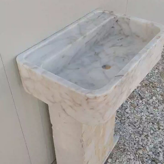 Stunning Calacatta Gold marble sink, featuring bold gold veining for a timeless look.