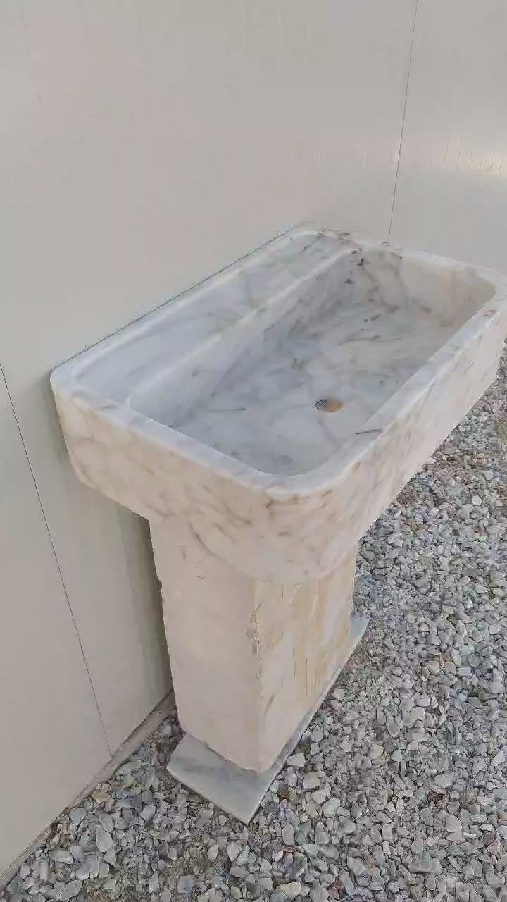 Stunning Calacatta Gold marble sink, featuring bold gold veining for a timeless look.
